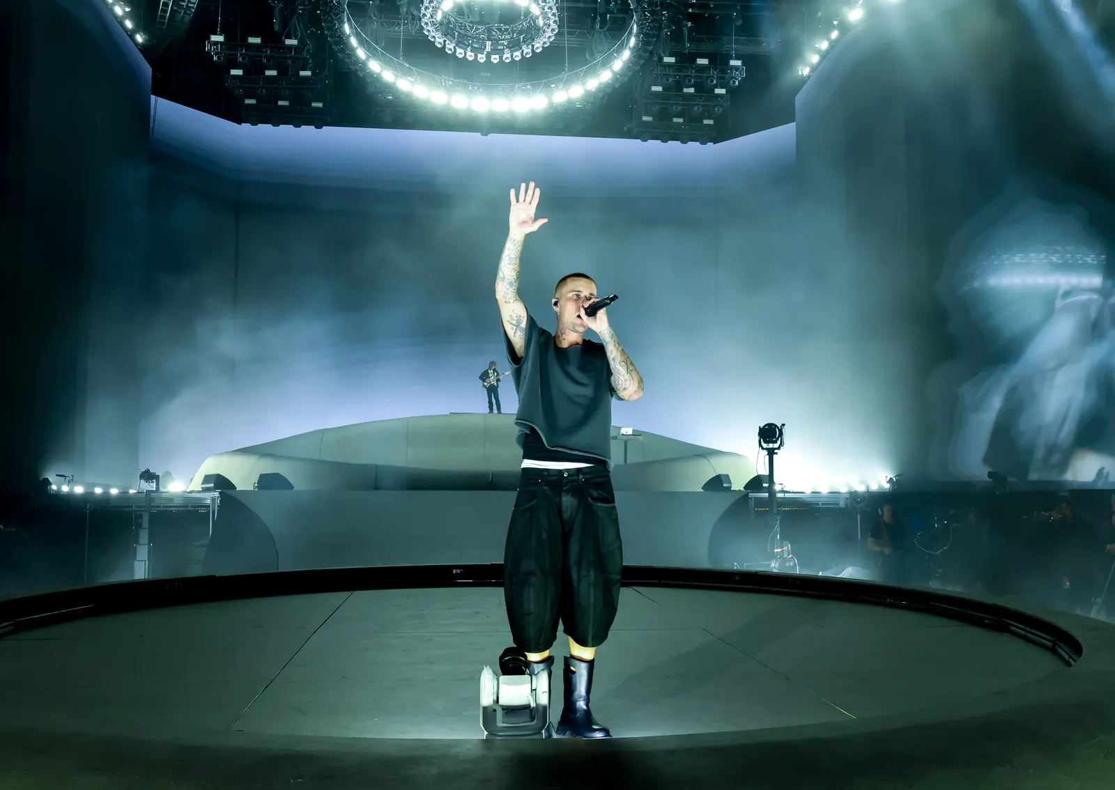 Image may contain Performer Person Solo Performance Lighting Leisure Activities Music Musical Instrument and Musician