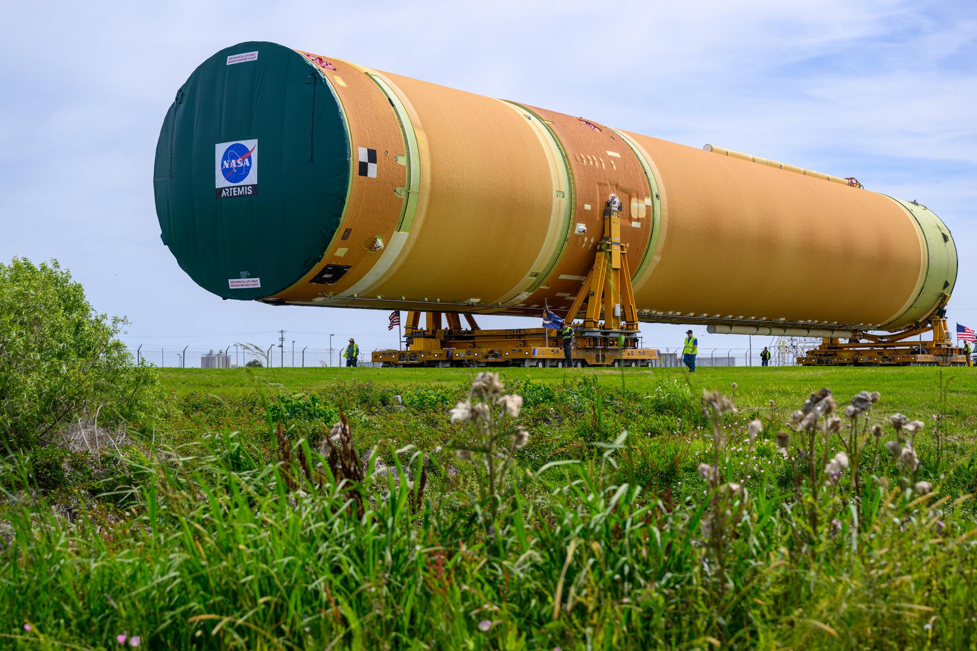 NASA moved the core stage, or the largest section, of the SLS (Space Launch System) rocket that will launch the crewed Artemis III mission in 2027 from the agency’s Michoud Assembly Facility to the agency’s Pegasus barge in New Orleans on April 20. The barge will ferry the top four-fifths – the section containing the liquid hydrogen tank, liquid oxygen tank, intertank, and forward skirt – of the SLS core stage to NASA’s Kennedy Space Center in Florida to complete outfitting and vertical integration.  Teams with NASA and Boeing, the SLS core stage lead contractor, used specialized transporters to guide the top four-fifths from the NASA rocket factory to Pegasus. Prior to the move, technicians added an engine section transportation simulator to the rocket stage for shipment to the Space Coast.  Next year’s Artemis III mission will launch astronauts to Earth’s orbit aboard the Orion spacecraft on top of SLS to test rendezvous and docking capabilities between Orion and commercial spacecraft needed to land Artemis IV astronauts on the Moon in 2028. NASA’s SLS is the only rocket capable of sending Orion, astronauts, and supplies to the Moon in a single launch.   Photo Credit: NASA/Eric Bordelon