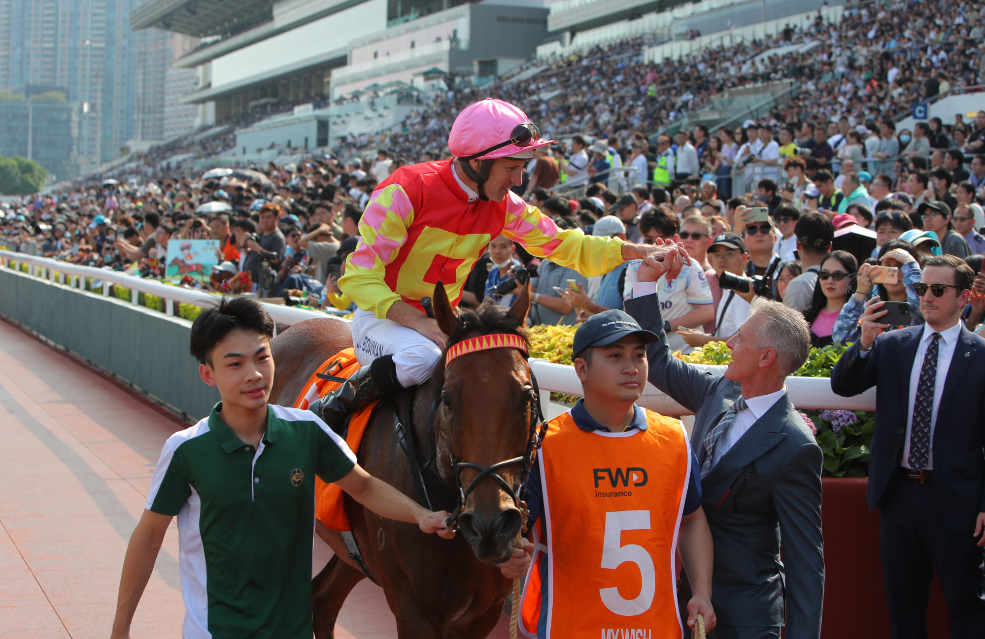 Hugh Bowman and Mark Newnham celebrate the Group One win of My Wish. Hugh Bowman and Mark Newnham celebrate the Group One win of My Wish.