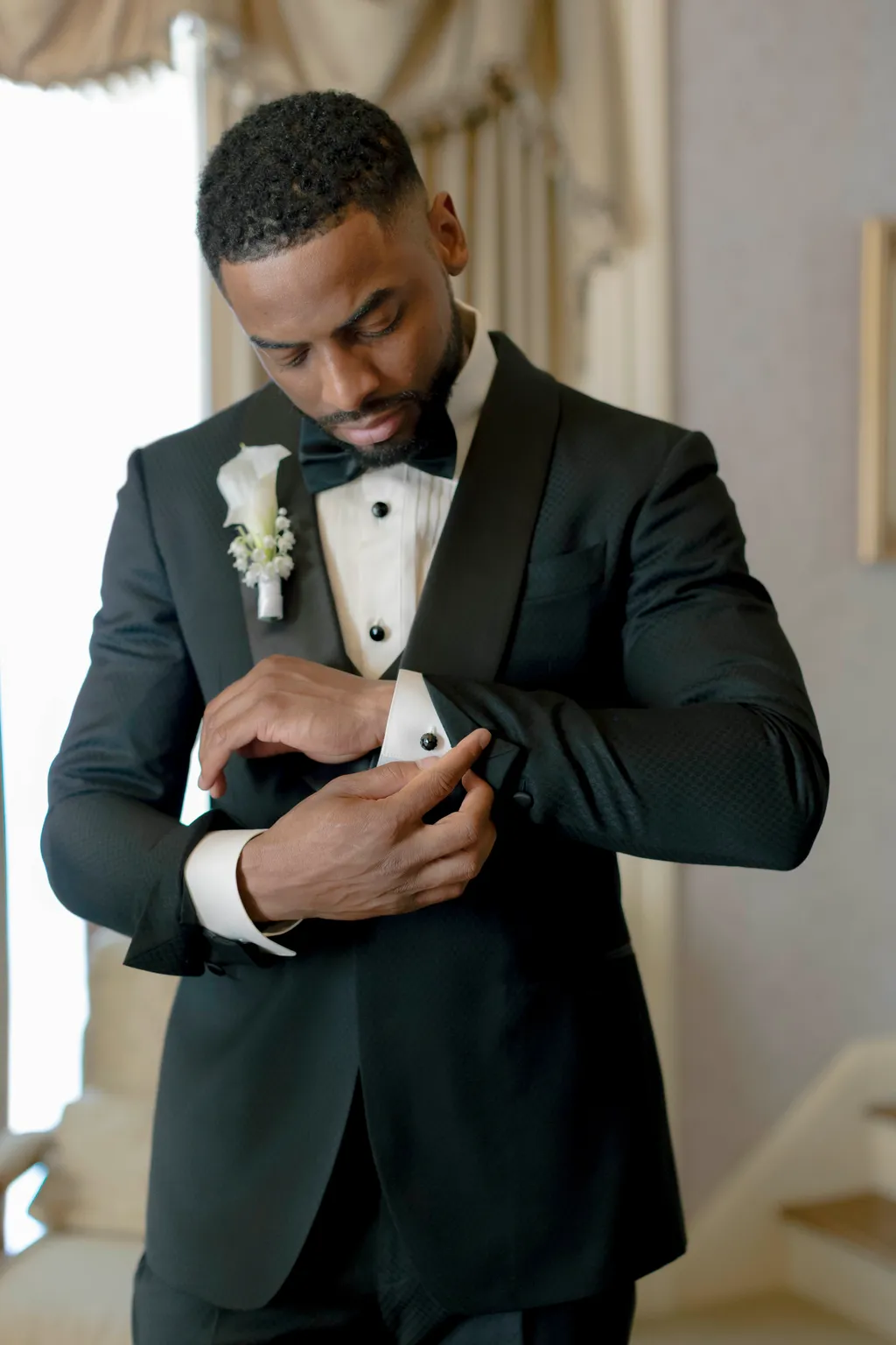 Image may contain Clothing Formal Wear Suit Tuxedo Blazer Coat Jacket Adult Person Wedding Face and Head