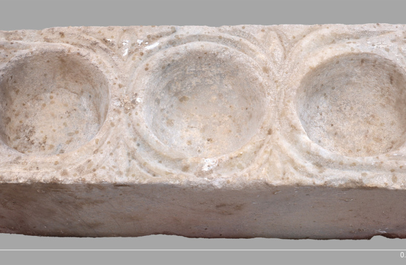 The rectangular marble block with three hemispheric cavities for oils found in the ancient city of Hippos, March 31, 2026.
