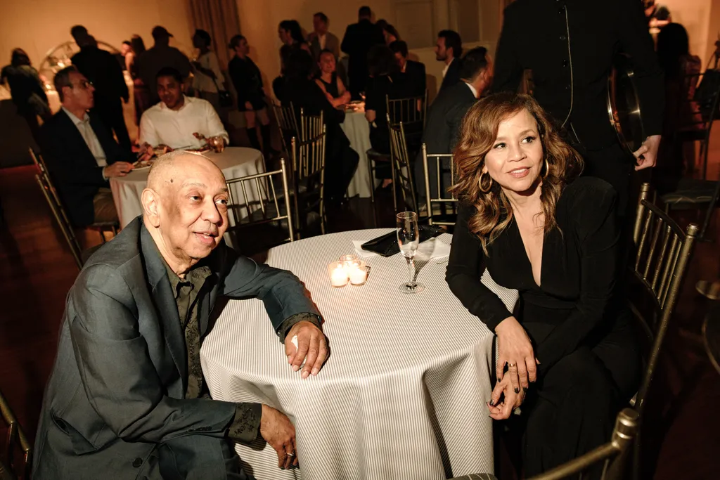 Image may contain George C. Wolfe Rosie Perez Dining Table Furniture Table Architecture Building and Dining Room