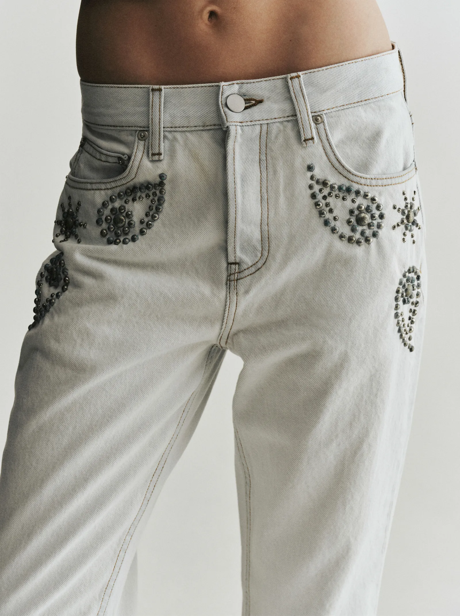 Image may contain Clothing Pants Person Jeans Home Decor Linen and Shorts