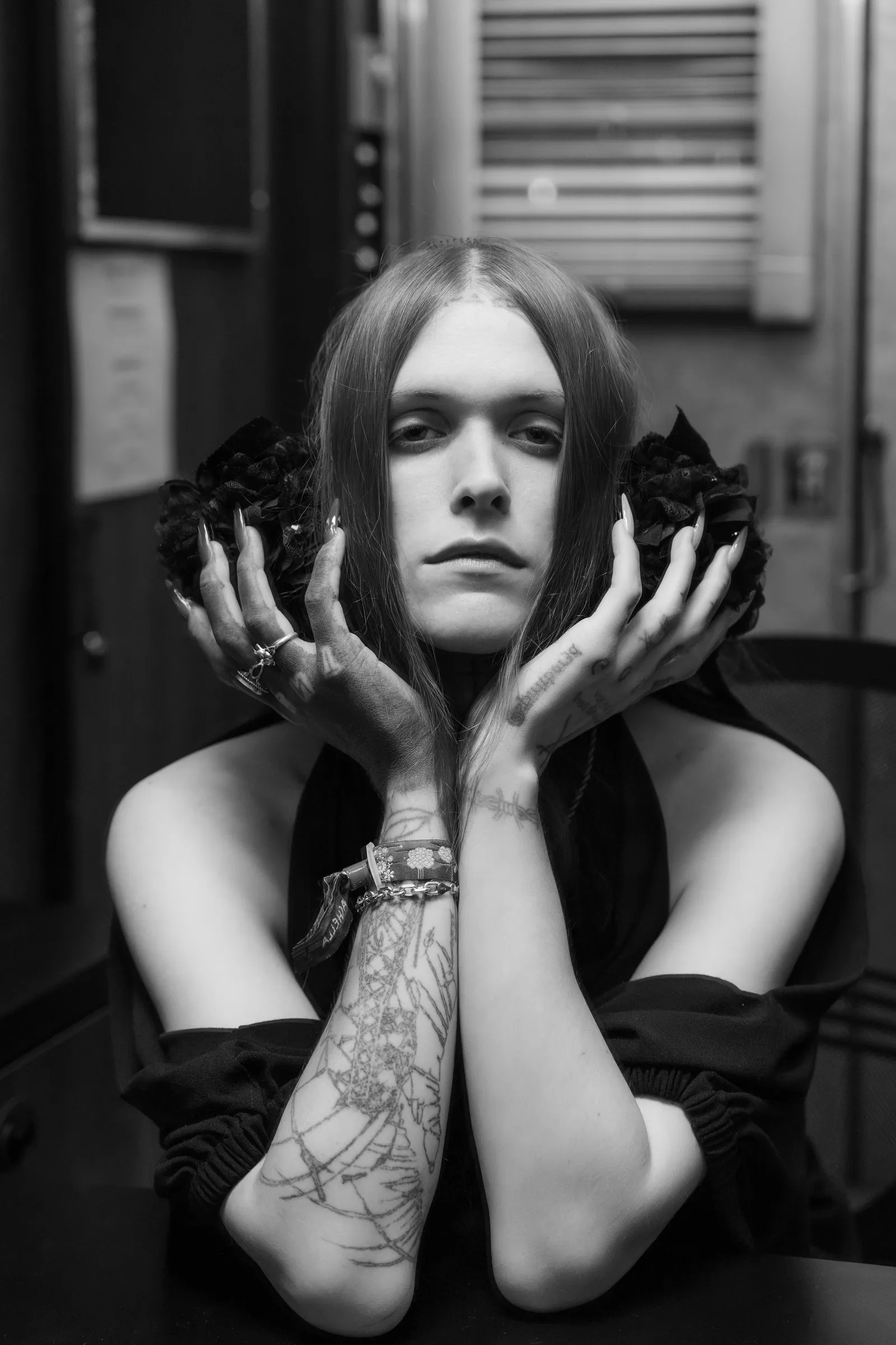 Image may contain Body Part Finger Hand Person Skin Tattoo Face Head Photography Portrait Adult and Wrist