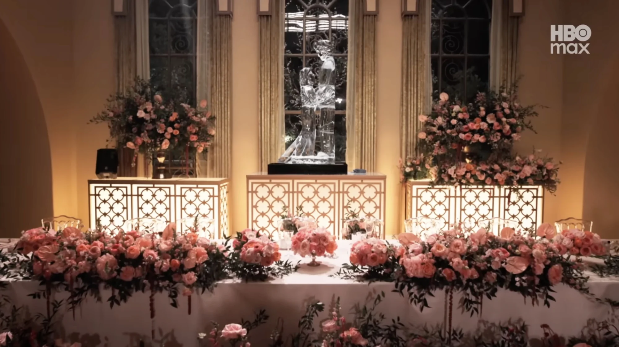 A wedding table covered in flowers.