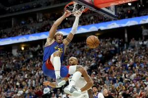 DENVER, COLORADO - APRIL 20: Aaron Gordon #32 of the Denver Nuggets dunks on Rudy Gobert #27 of the Minnesota Timberwolves in the first quarter during Game Two of the First Round of the NBA Western Conference Playoffs at Ball Arena on April 20, 2026 in Denver, Colorado. NOTE TO USER: User expressly acknowledges and agrees that, by downloading and or using this photograph, User is consenting to the terms and conditions of the Getty Images License Agreement. (Photo by Matthew Stockman/Getty Images)