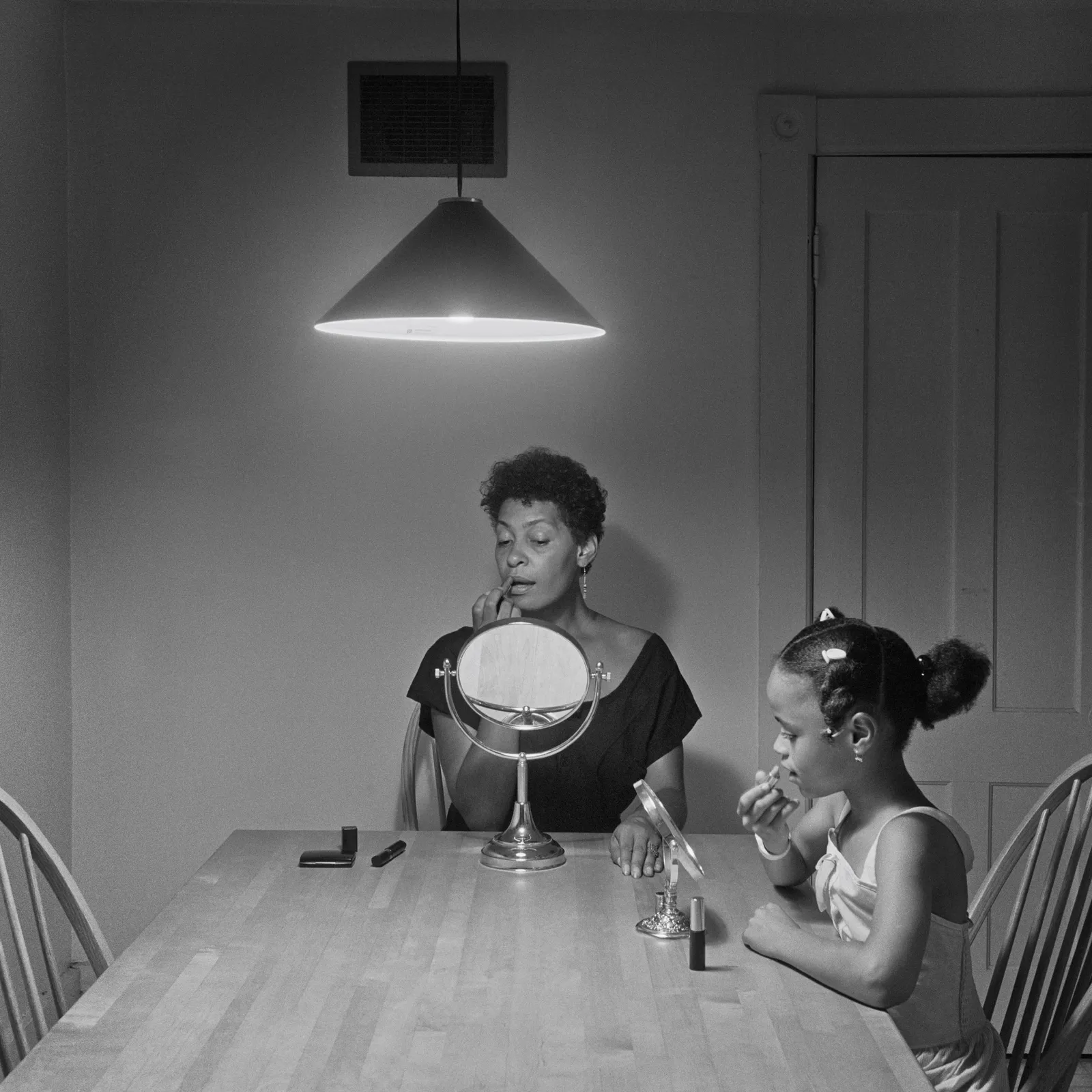 Image may contain Carrie Mae Weems Adult Person Child Lamp Architecture Building Dining Room and Dining Table