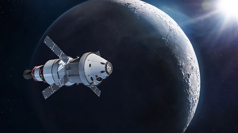 The Orion spacecraft flying past the moon