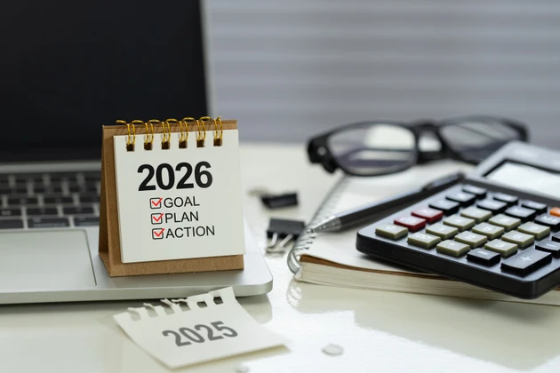 Desk calendar 2026 with checklist Goal, Plan, Action on office workspace beside calculator, notebook, pen and laptop, represent financial planning, budget, KPI targets and execution for the new year