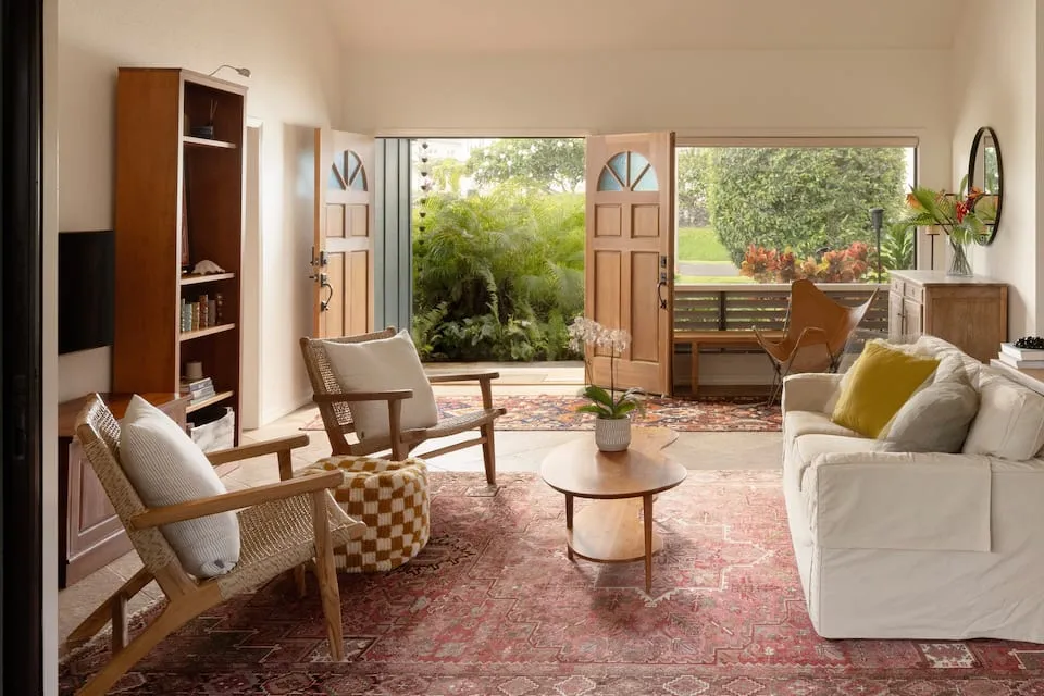 Image may contain Home Decor Floor Chair Furniture Coffee Table Table Rug Door Architecture Building and Foyer