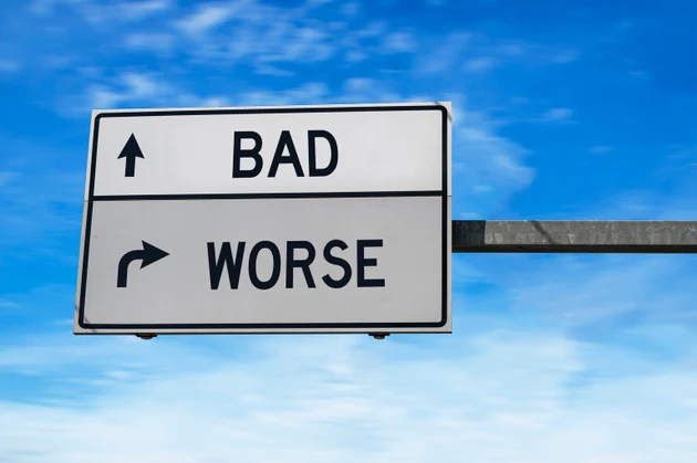 Two arrow sign with words bad and worse.
