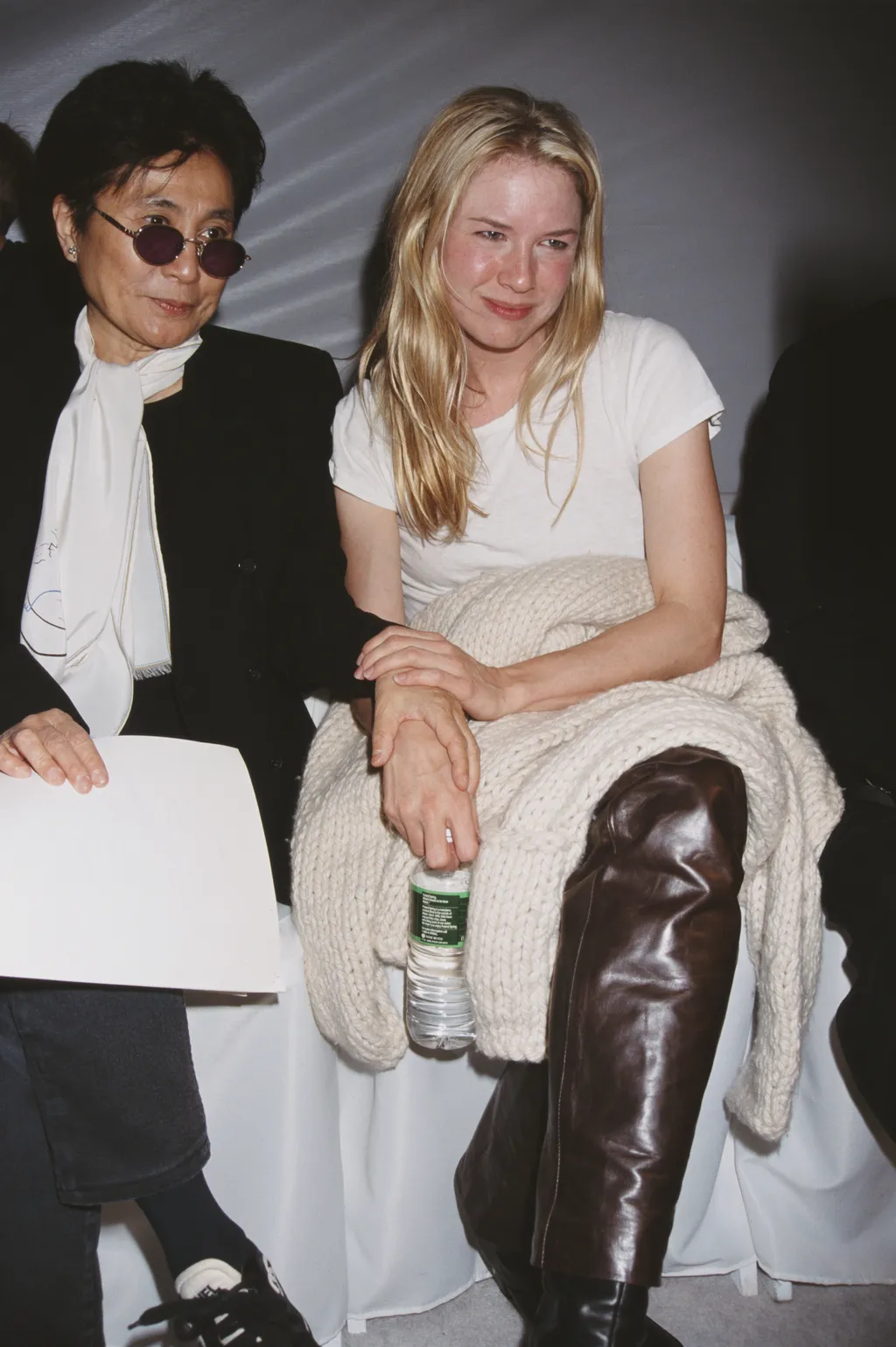 Image may contain Yoko Ono Rene Zellweger Adult Person Clothing Coat Face Head Photography Portrait and People
