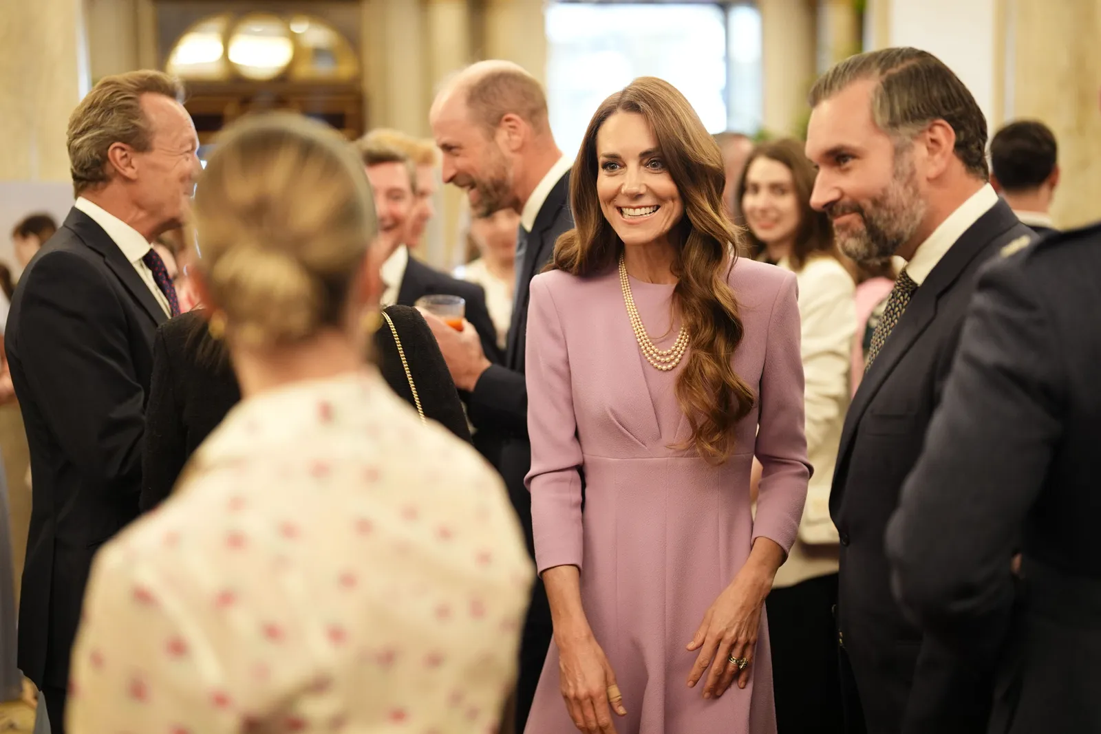 Image may contain Prince William Duke of Cambridge Person Face Happy Head Smile Accessories Jewelry Ring and Cup