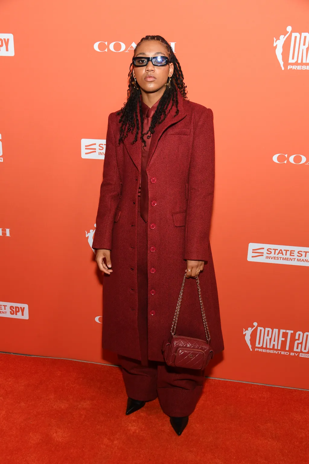 Image may contain Fashion Clothing Coat Person and Standing