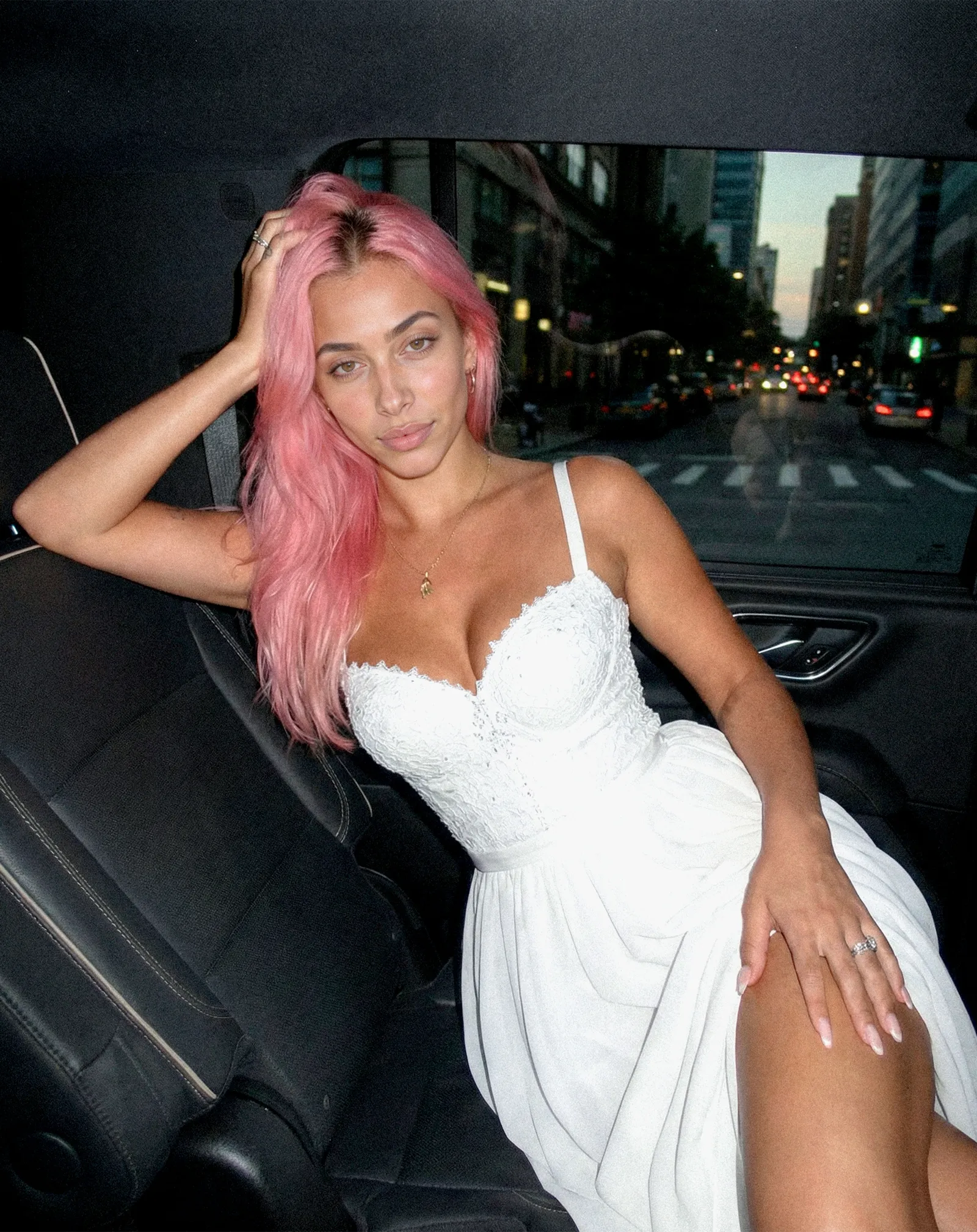 Image may contain Hair Person Adult Pink Hair Accessories Jewelry Necklace Car Transportation and Vehicle