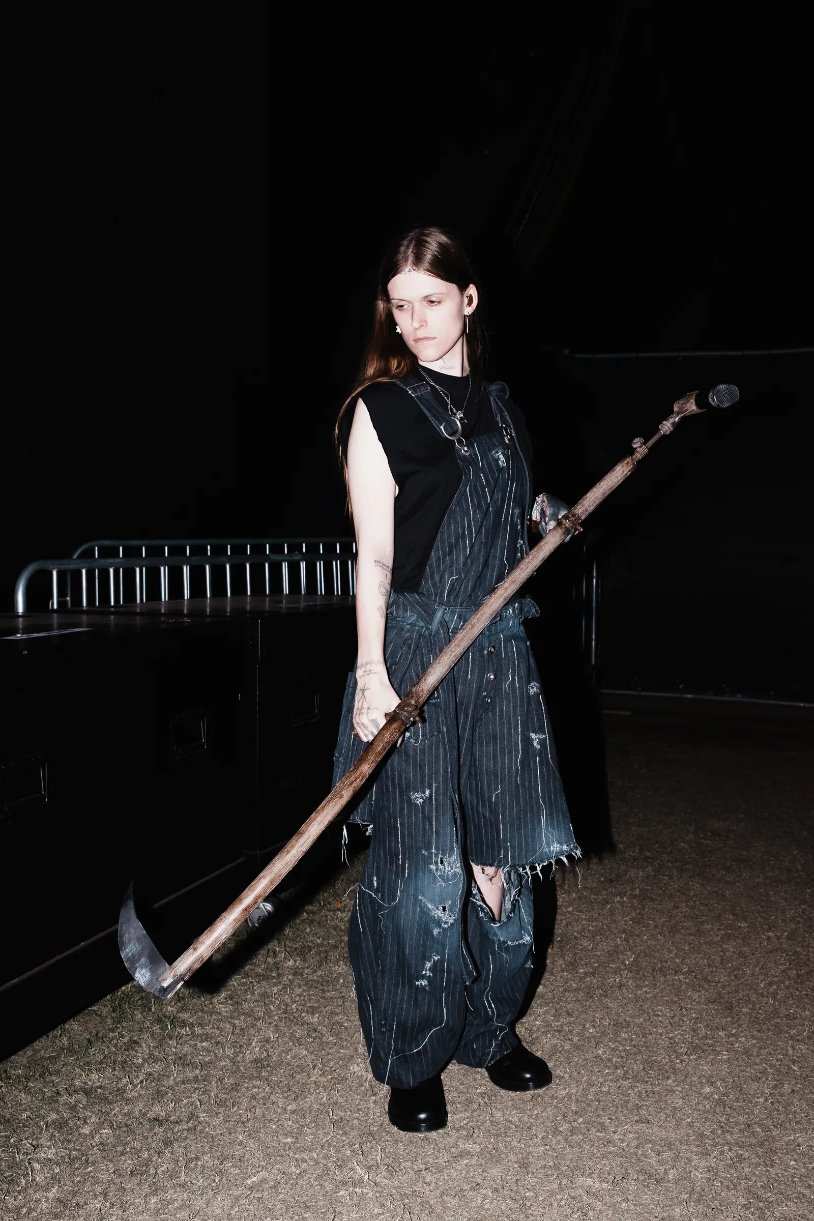 Image may contain Accessories Jewelry Necklace Clothing Dress Spear Weapon Adult Person Sword Device and Footwear