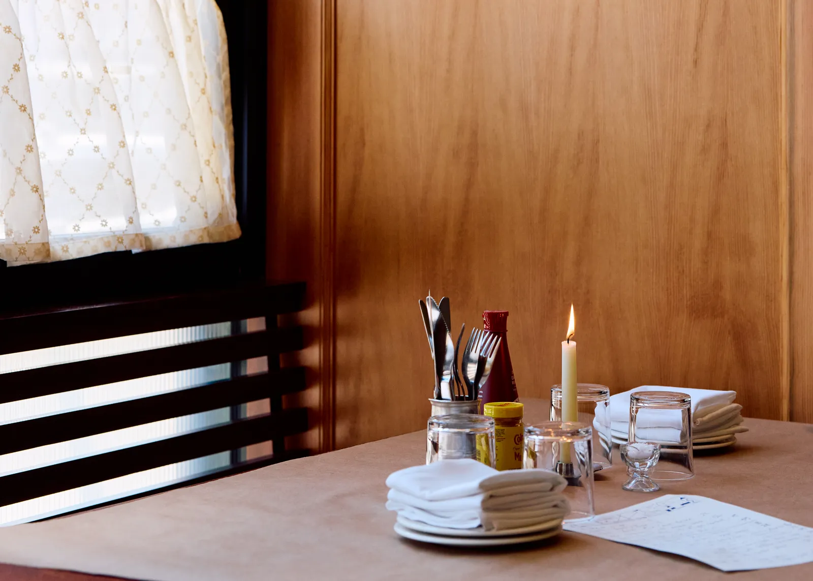 Image may contain Cutlery Furniture Table Tabletop Dining Table Fork Indoors Interior Design and Candle