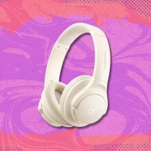 soundcore by anker q20i headphones against a pink and purple patterned background
