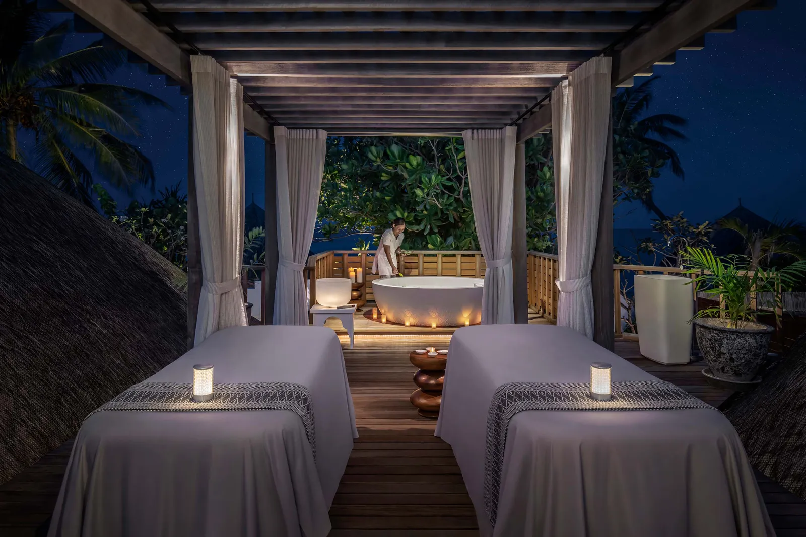 Image may contain Indoors Furniture Bed Bedroom Room Hot Tub Tub Person and Spa