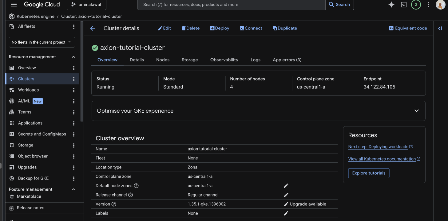 GCP Console Kubernetes Engine Clusters page showing axion-tutorial-cluster with a green checkmark status, the zone us-central1-a, and Kubernetes version in the table.