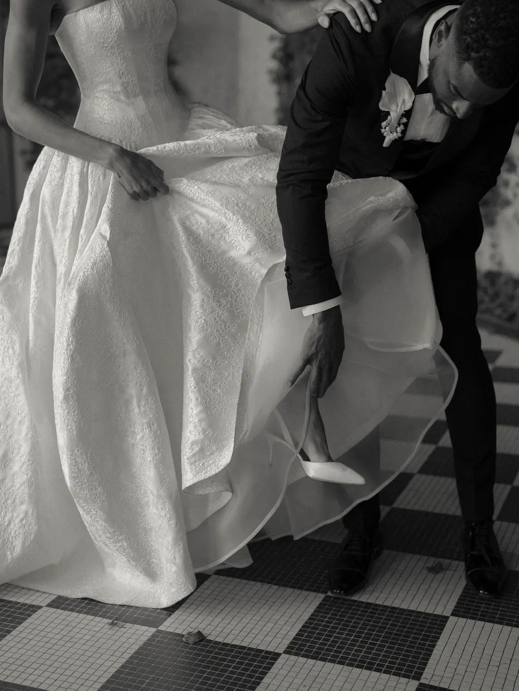 Image may contain Clothing Dress Formal Wear Fashion Gown Wedding Wedding Gown Adult Person Suit and Footwear