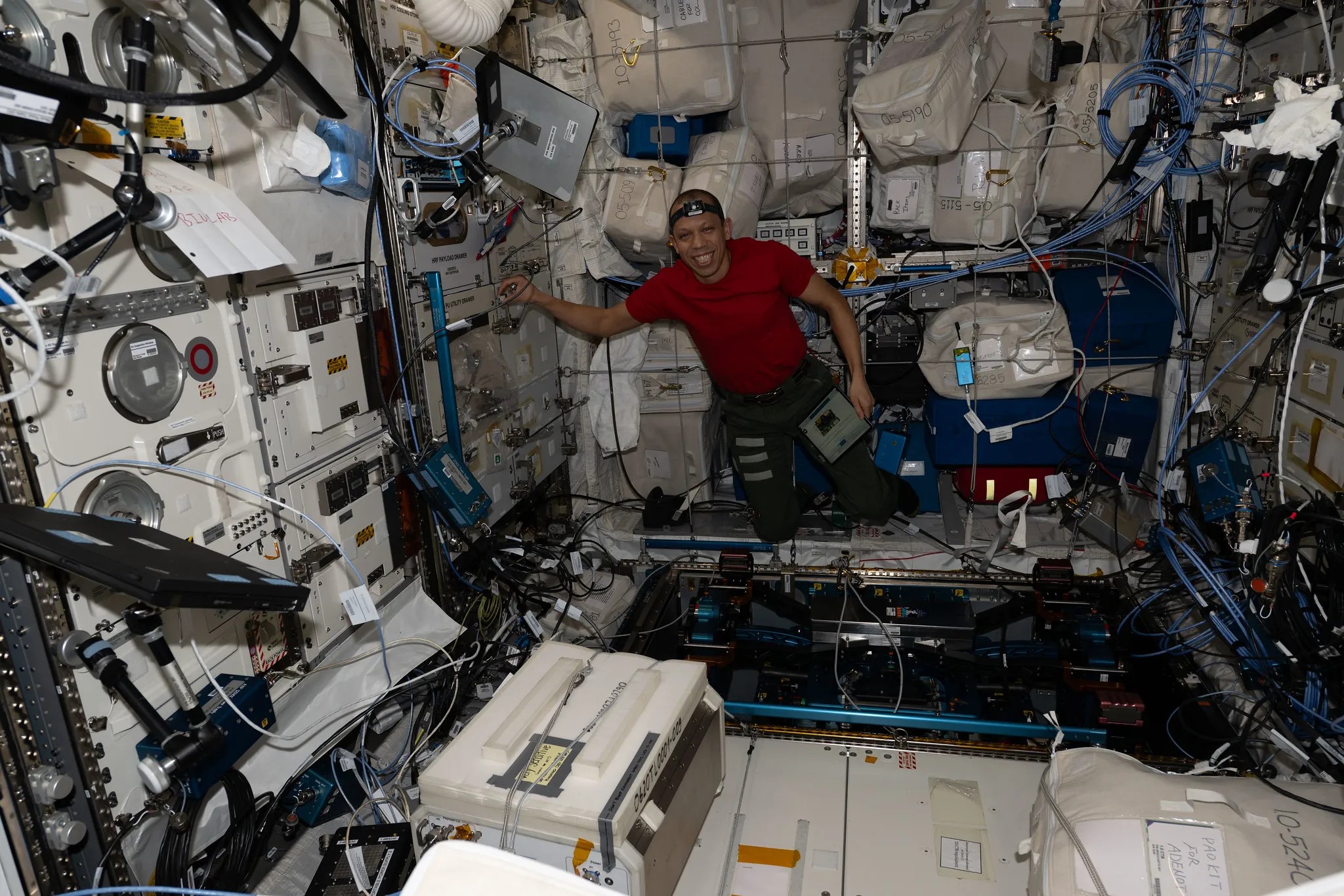 NASA astronaut Chris Williams unpacks computer hardware on the ISS on April 15th, 2026.
