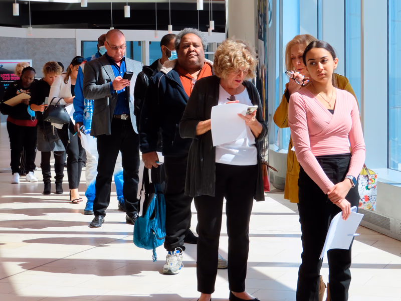 People wait at a job fair