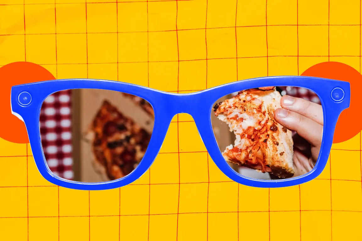 Smart glasses with reflective lenses showing a close-up of a hand holding a partially eaten slice of pizza. The background is bright yellow with a red grid pattern and two orange circles behind the sunglasses.