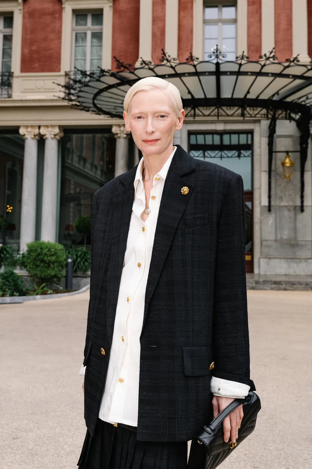 Image may contain Tilda Swinton Person Clothing Coat Blazer Jacket and Adult
