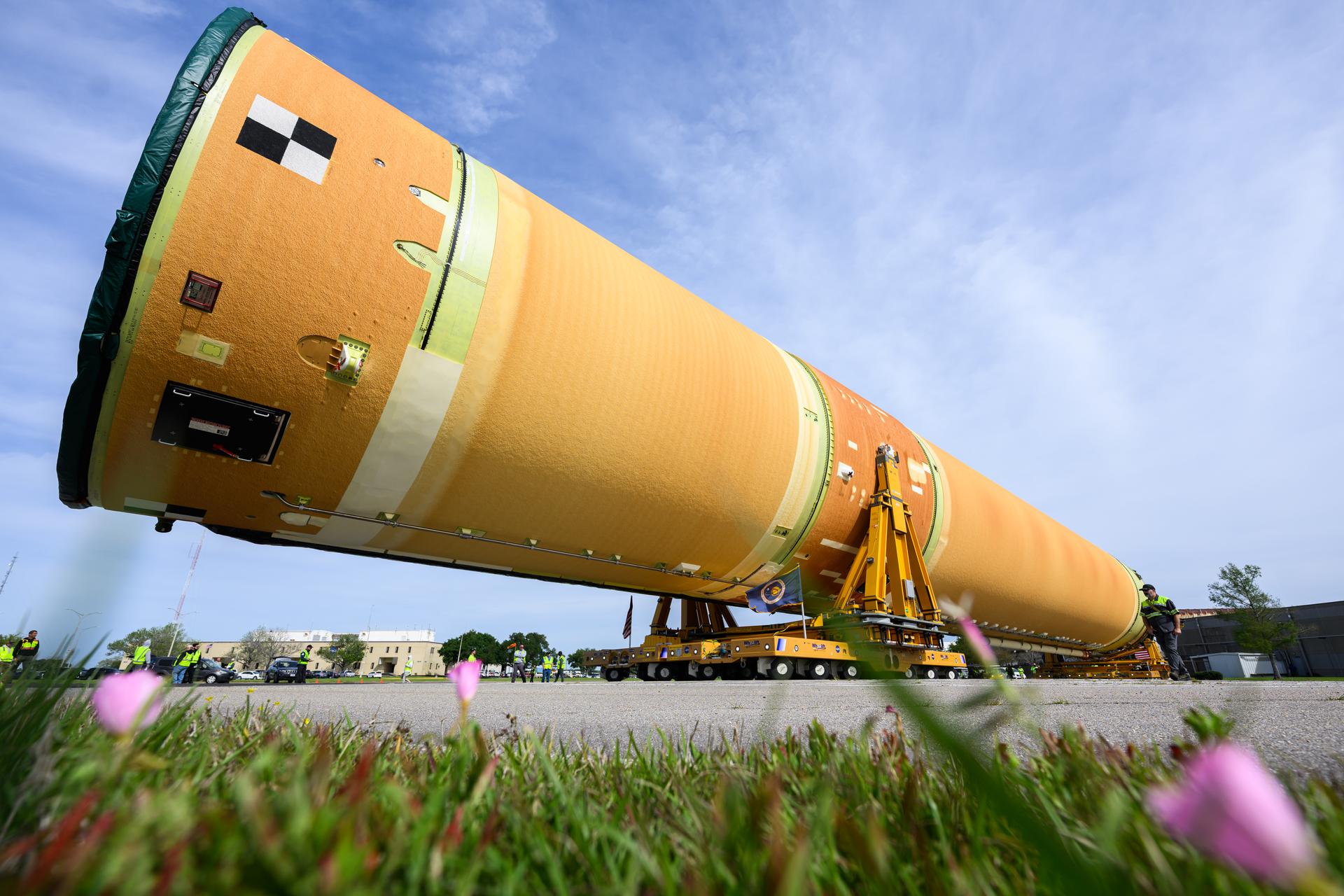 NASA moved the core stage, or the largest section, of the SLS (Space Launch System) rocket that will launch the crewed Artemis III mission in 2027 from the agency’s Michoud Assembly Facility to the agency’s Pegasus barge in New Orleans on April 20. The barge will ferry the top four-fifths – the section containing the liquid hydrogen tank, liquid oxygen tank, intertank, and forward skirt – of the SLS core stage to NASA’s Kennedy Space Center in Florida to complete outfitting and vertical integration.  Teams with NASA and Boeing, the SLS core stage lead contractor, used specialized transporters to guide the top four-fifths from the NASA rocket factory to Pegasus. Prior to the move, technicians added an engine section transportation simulator to the rocket stage for shipment to the Space Coast.  Next year’s Artemis III mission will launch astronauts to Earth’s orbit aboard the Orion spacecraft on top of SLS to test rendezvous and docking capabilities between Orion and commercial spacecraft needed to land Artemis IV astronauts on the Moon in 2028. NASA’s SLS is the only rocket capable of sending Orion, astronauts, and supplies to the Moon in a single launch.   Photo Credit: NASA/Eric Bordelon