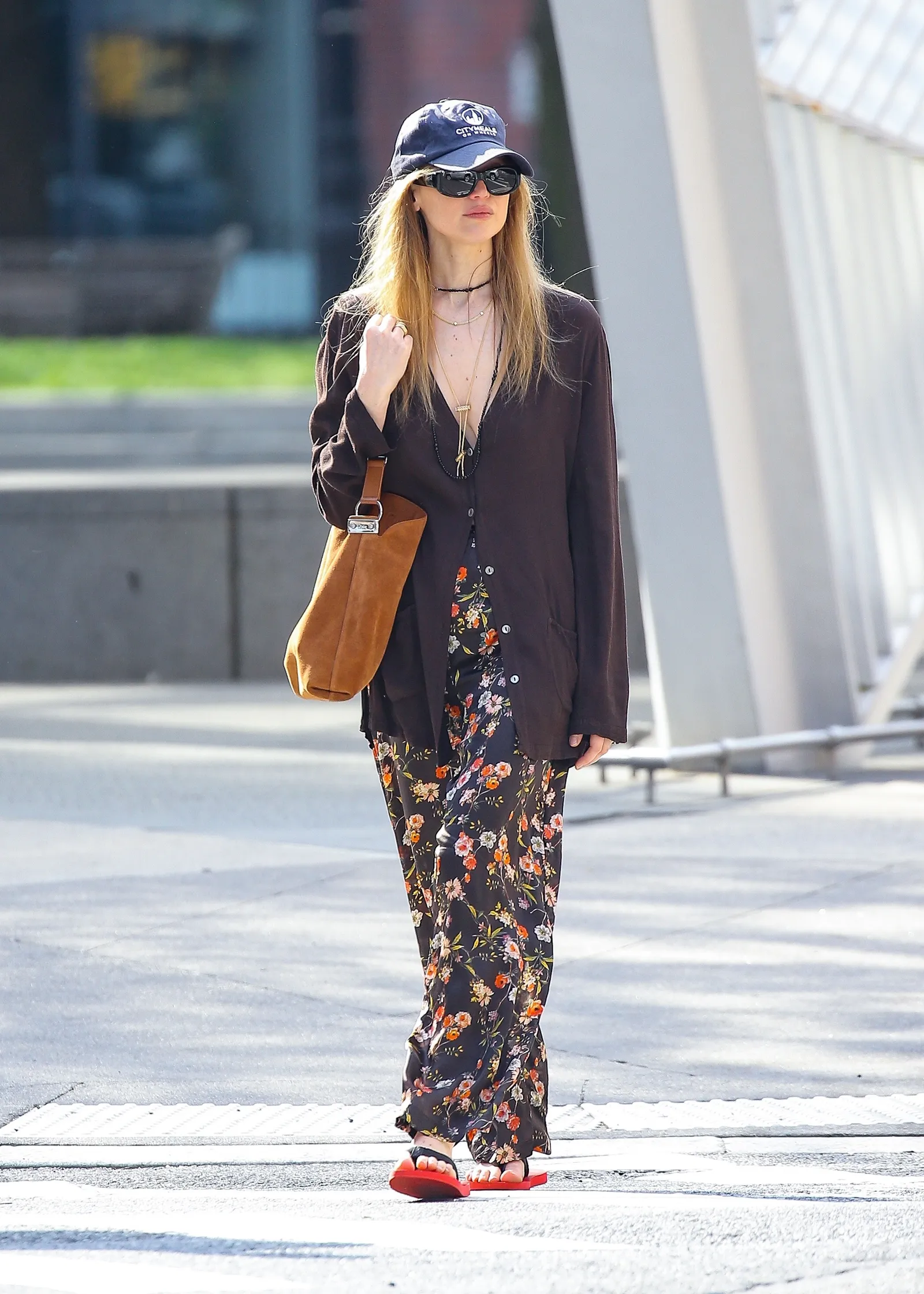 Image may contain Jennifer Lawrence Clothing Pants Pedestrian Person Formal Wear Suit Adult Accessories and Bag
