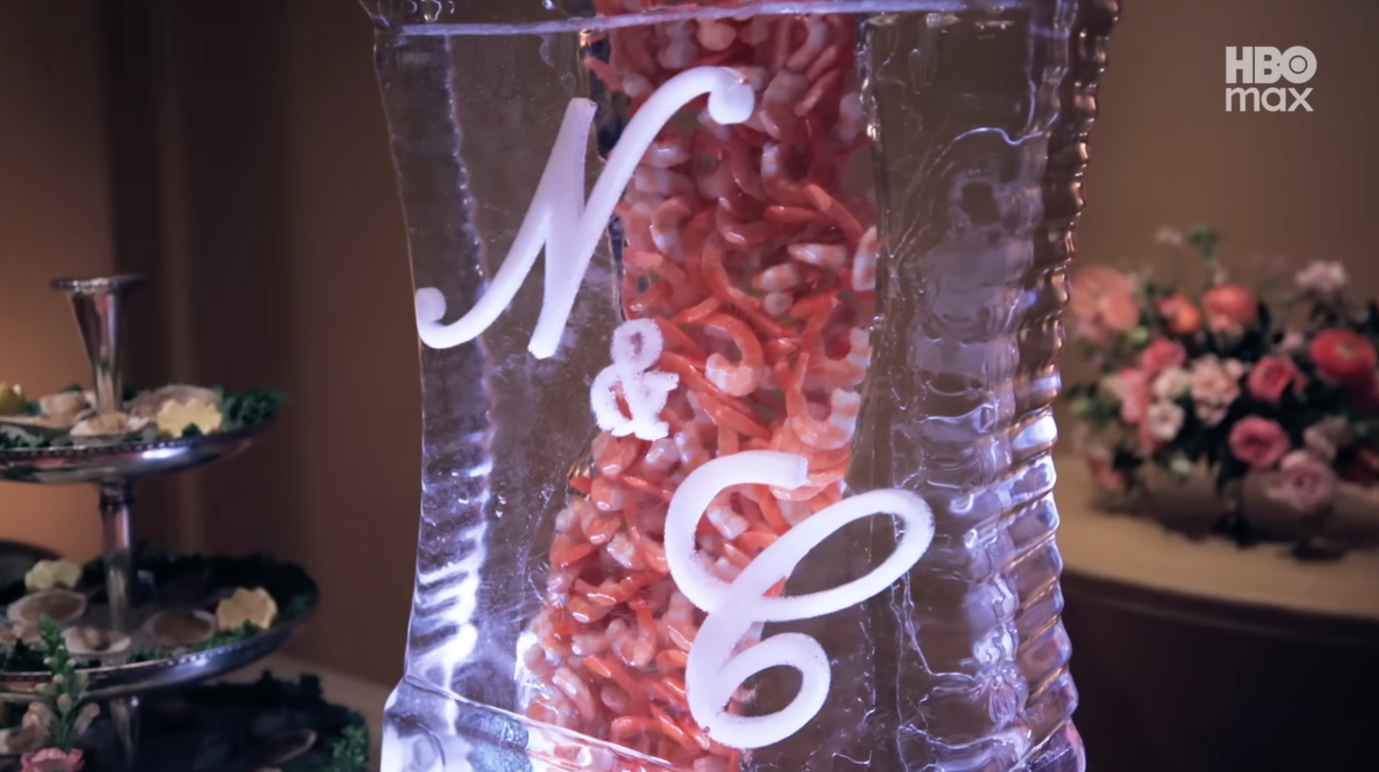 Prawns are encased in an ice sculpture with the initials N&C.