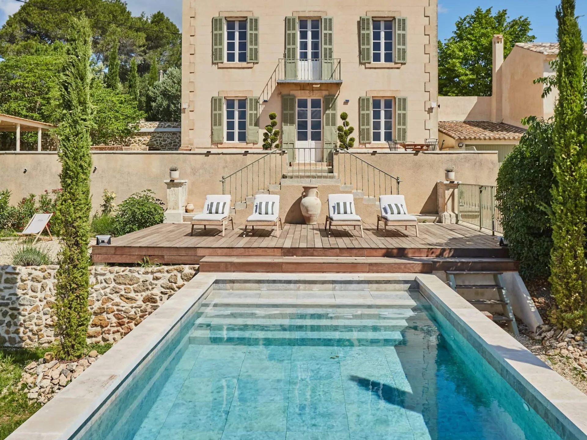 Image may contain Architecture Building House Housing Villa Chair Furniture Pool Water Swimming Pool and Outdoors