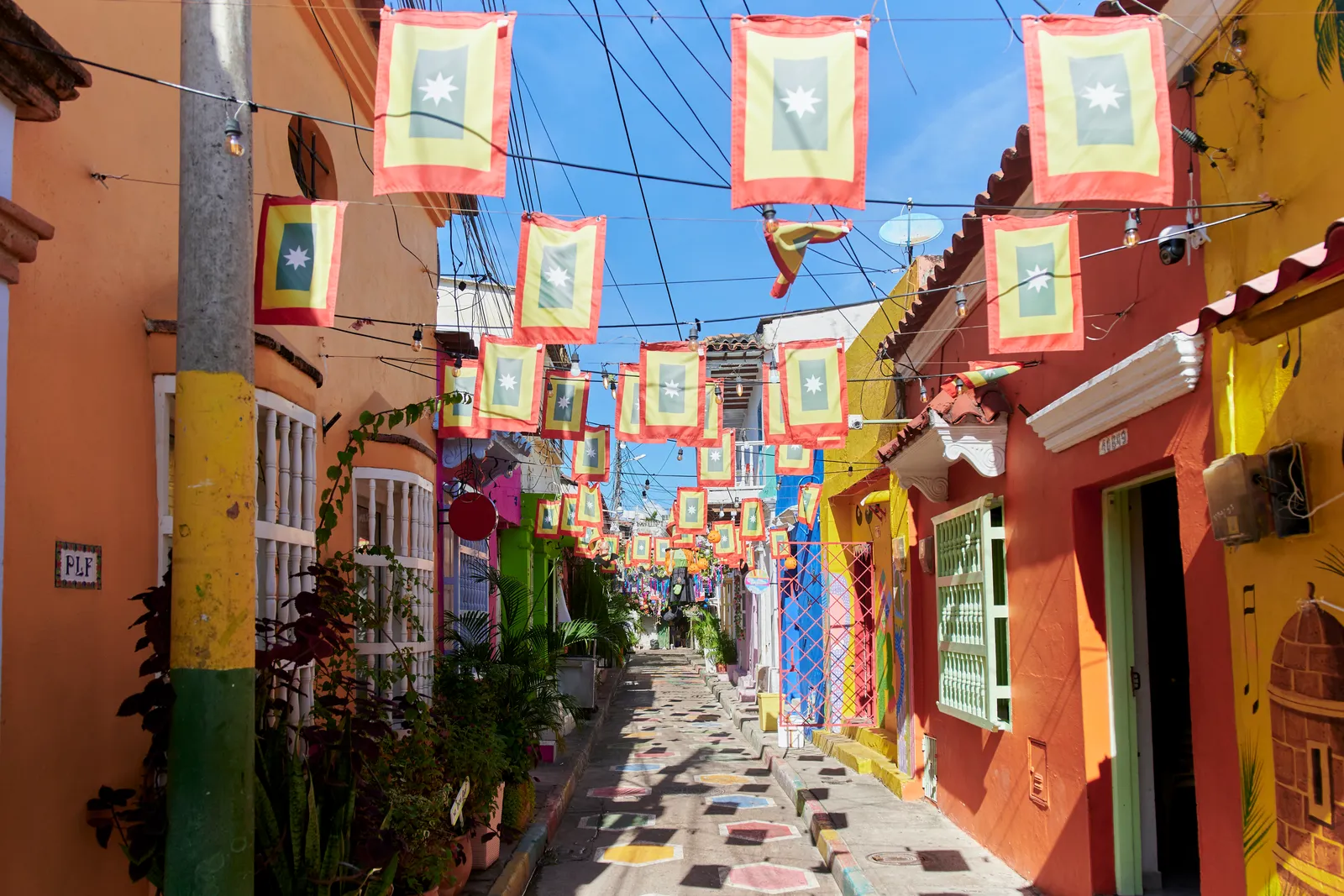 Image may contain City Road Street Urban Alley Flag Architecture and Building
