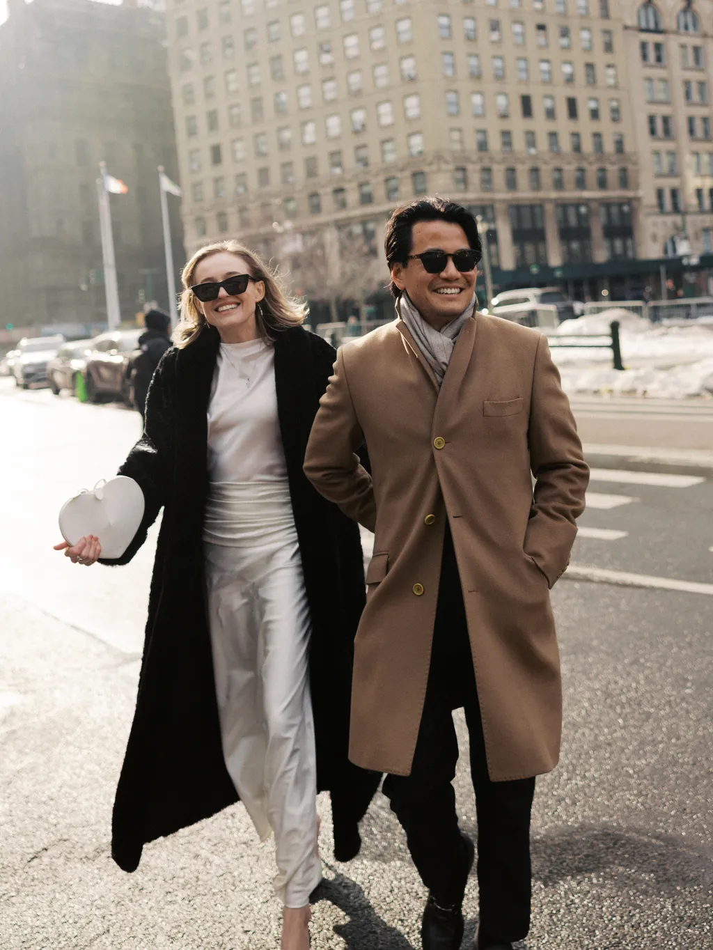 Image may contain Clothing Coat Blazer Jacket City Road Street Urban People Person Walking Overcoat and Face