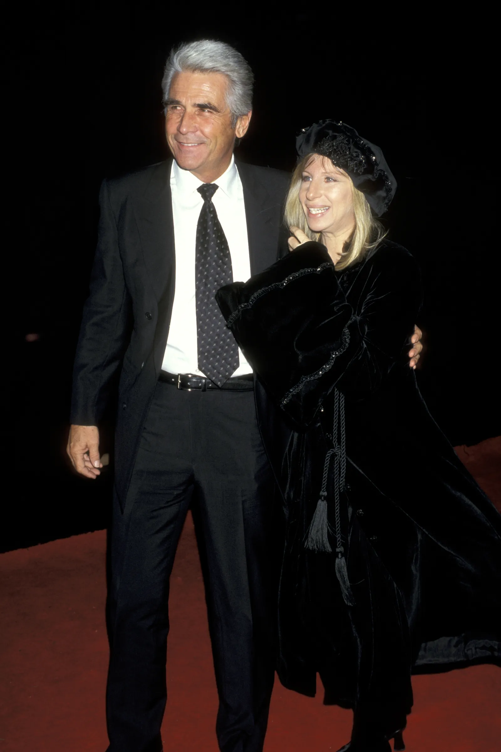 Image may contain James Brolin Barbra Streisand Fashion Clothing Coat Blazer Jacket Formal Wear Suit Face and Head
