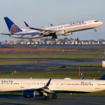 A United Airlines jet takes off while a Delta Airlines plane taxis at Logan International Airport.
