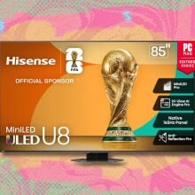hisense 85-inch class u8 mini-led uled 4k tv against a yellow, pink, and green patterned background