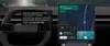 An Android Auto screen displaying a music request. On the left, a voice command transcription asks for an upbeat road trip playlist for kids. On the right, a media player card shows a track titled "You got to listen" overlaid on a map navigation screen