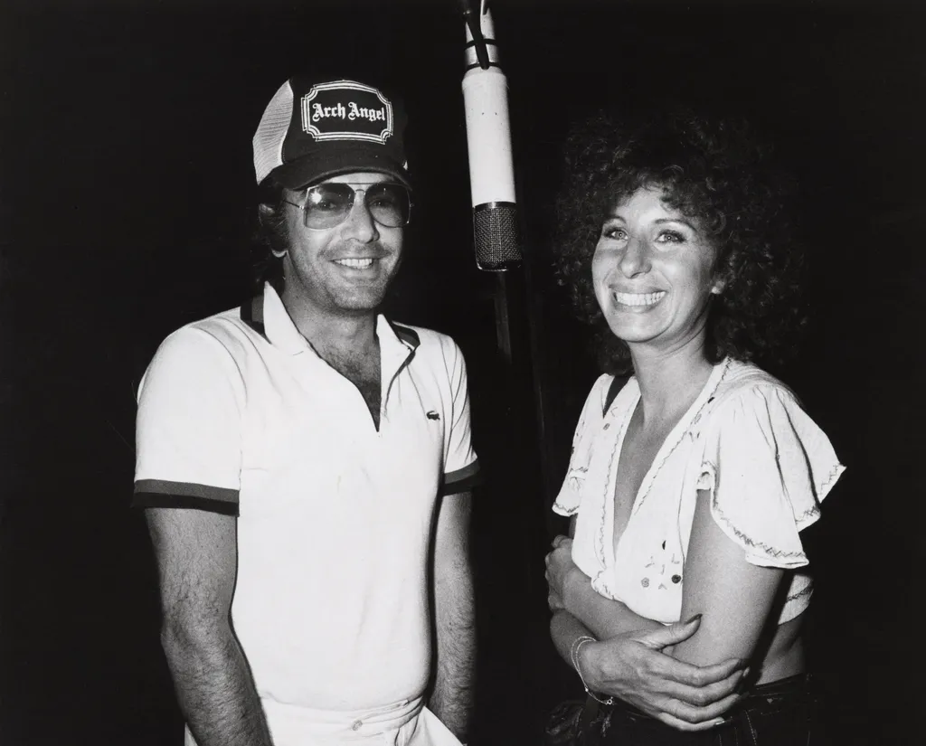 Image may contain Barbra Streisand Human Person Clothing Apparel Hair Neil Diamond and Hat