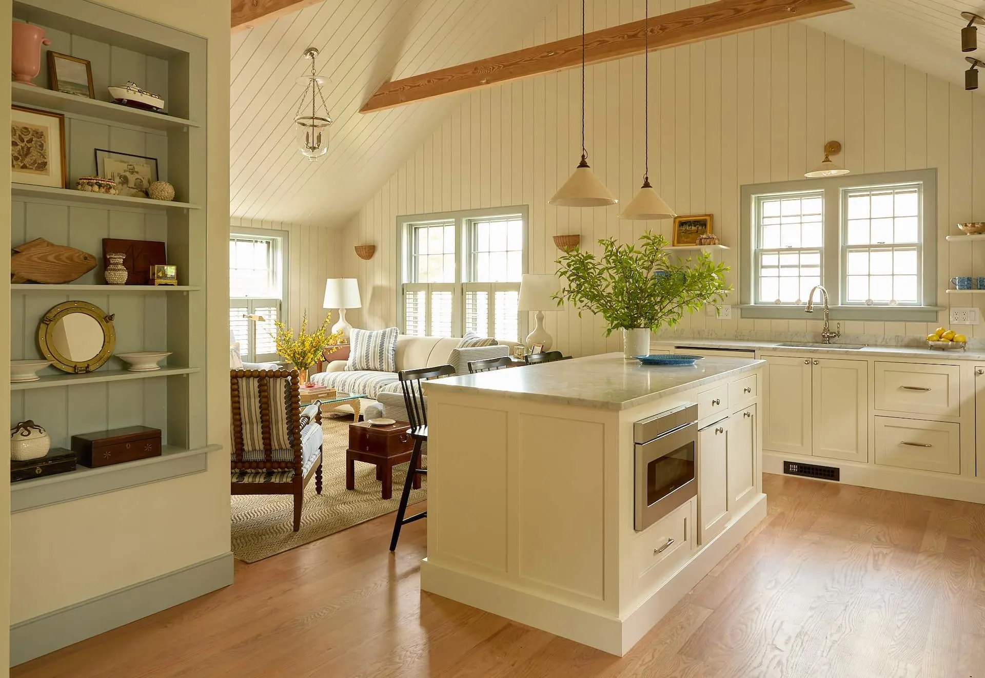 Image may contain Indoors Interior Design Kitchen Home Decor Couch Furniture Chair Plant and Kitchen Island
