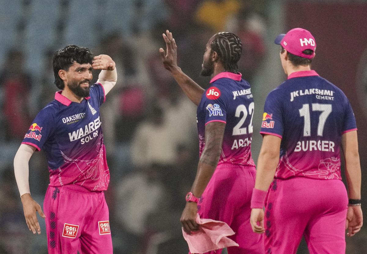 Rajasthan Royals' Brijesh Sharma, Jofra Archer, and Nandre Burger celebrate after winning against Lucknow Super Giants. Rajasthan Royals' Brijesh Sharma, Jofra Archer, and Nandre Burger celebrate after winning against Lucknow Super Giants.