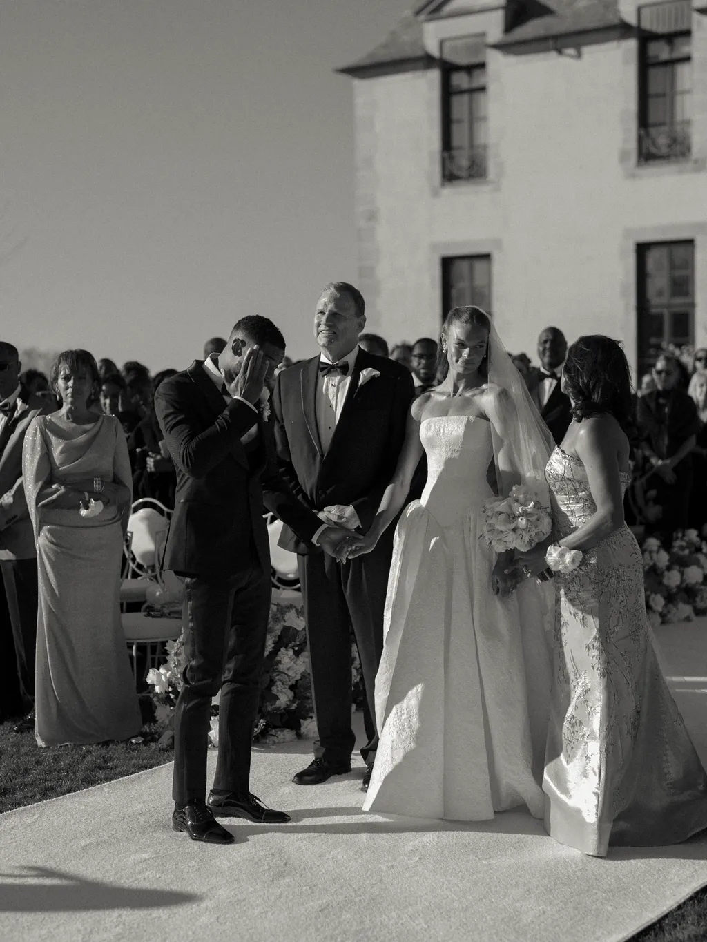 Image may contain Jacques De Peretti Tina Allen Hakeem Olajuwon Clothing Dress Fashion Formal Wear Gown and Suit