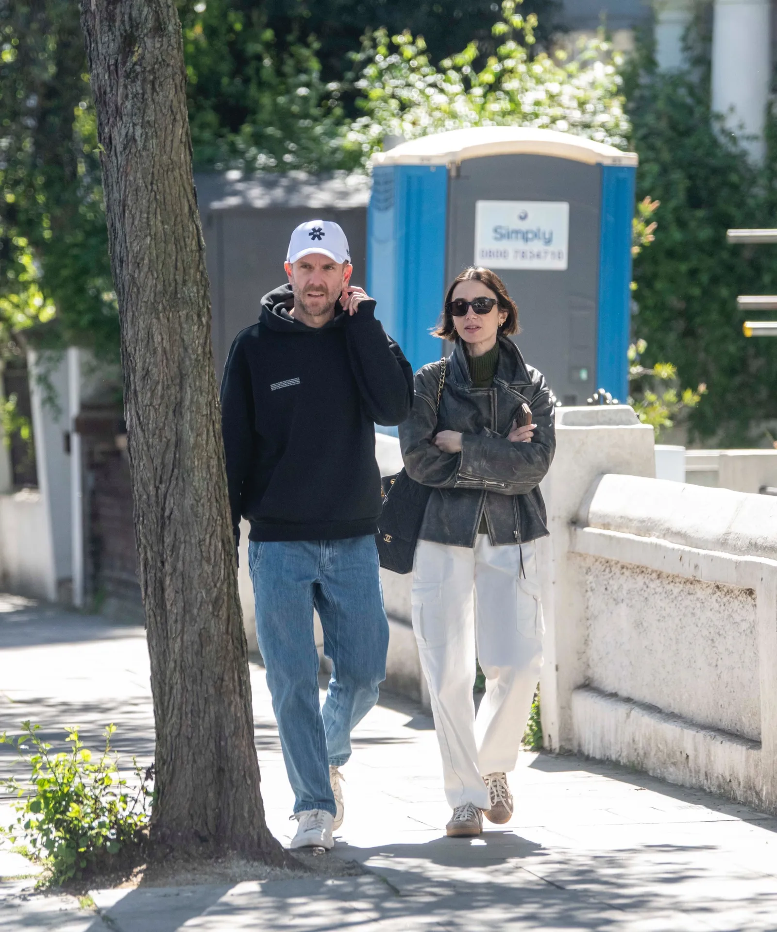 EXCLUSIVE London UNITED KINGDOM SUBSCRIPTIONS Emily in Paris star Lily Collins smiles as she visits a pet store with...
