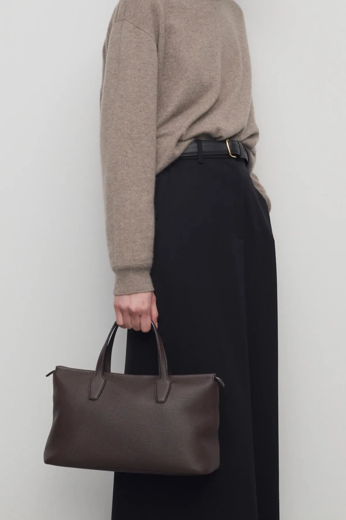 Image may contain Bag Accessories Handbag Clothing Long Sleeve Sleeve Tote Bag and Coat