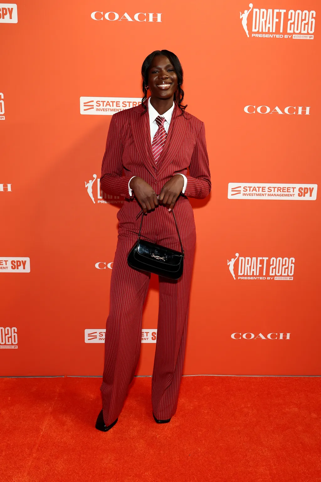 Image may contain Clothing Formal Wear Suit Fashion Adult Person and Standing