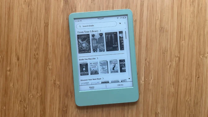 A 2024 Amazon Kindle on a wooden table