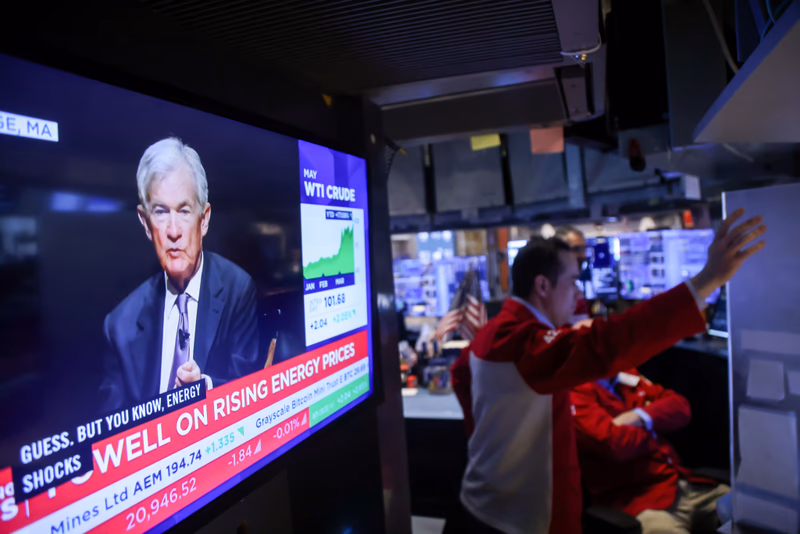 Federal Reserve Chair Jerome Powell speaking on high energy prices airs on a TV on the New York Stock Exchange trading floor.