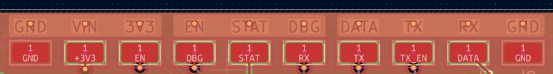 Top row: what the silkscreen says each test point is. Bottom row: what the test point is actually wired to. Apart from the GND endcaps and STAT, every label is wrong. The silkscreen never got updated after the nets were shuffled around during layout. PCB layout view of the test point row. The top row of silkscreen labels reads GND, VIN, 3V3, EN, STAT, DBG, DATA, TX, RX, GND. The bottom row, which shows the nets actually connected to each test point, reads GND, +3V3, EN, DBG, STAT, RX, TX, TX_EN, DATA, GND. Almost none of the silkscreen labels line up with the underlying nets.