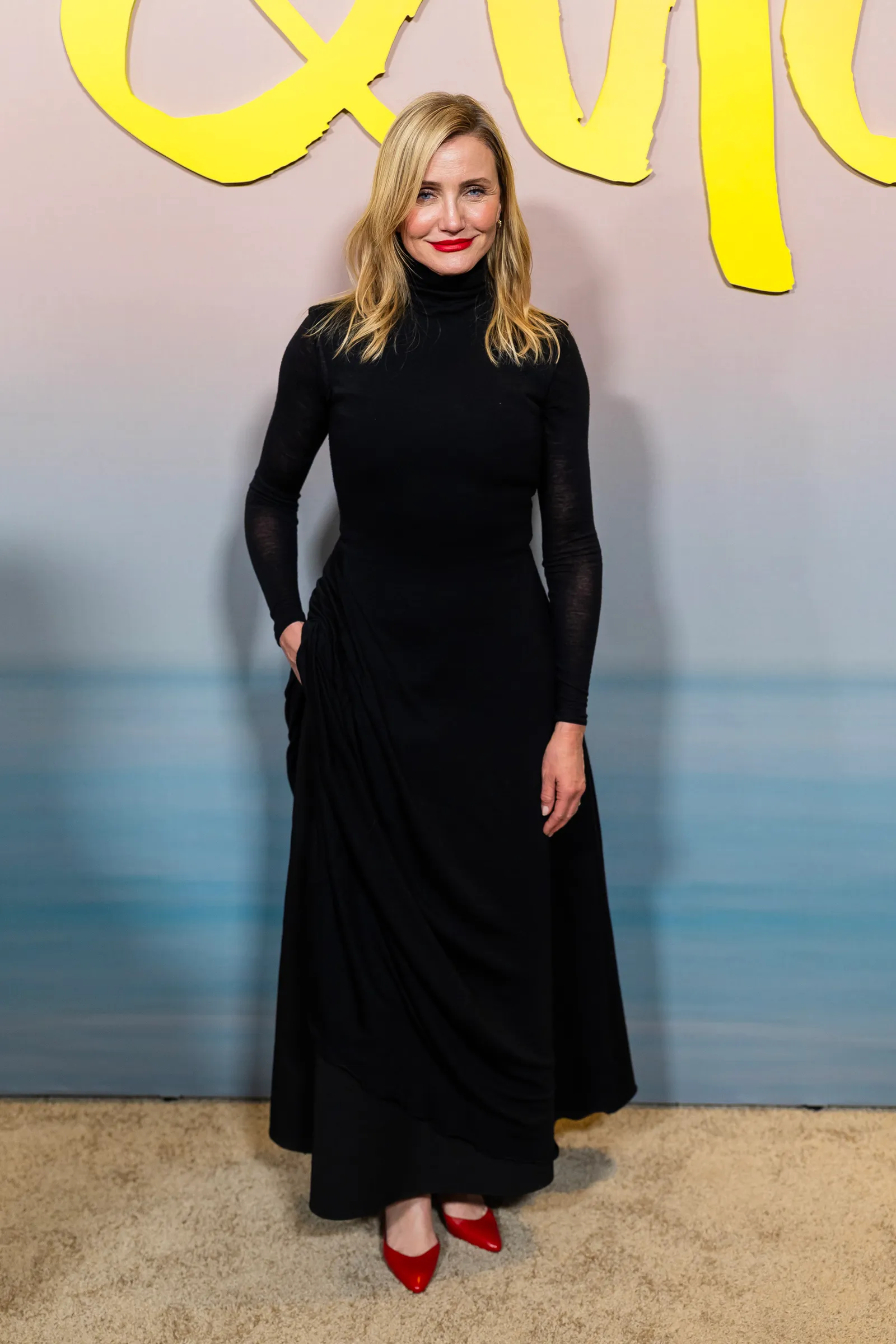Image may contain Cameron Diaz Clothing Dress Long Sleeve Sleeve Adult Person Blonde Hair and Formal Wear